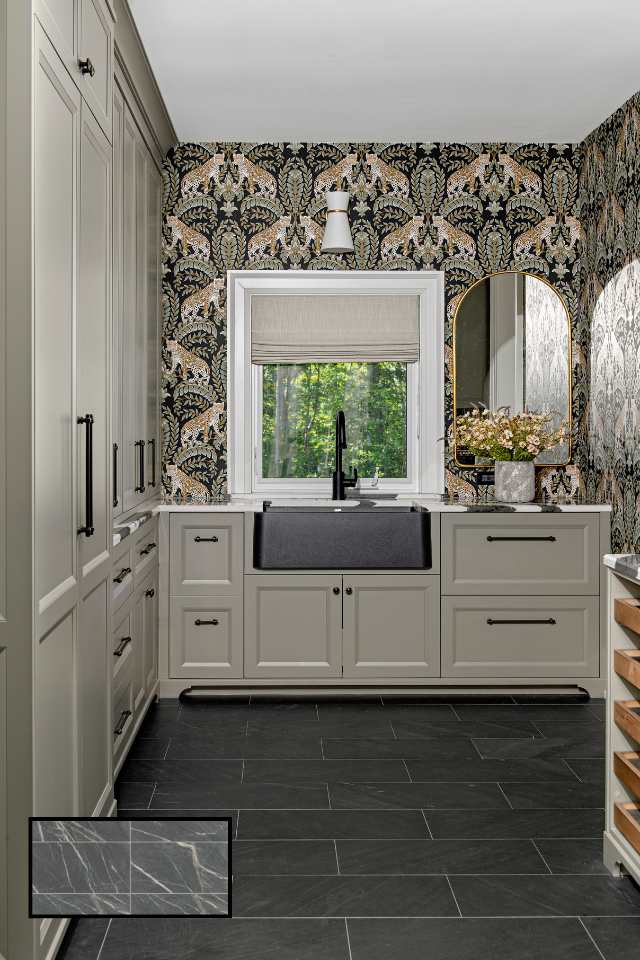eclectic wallpaper in mudroom with sage green cabinet storage and big farmhouse sink